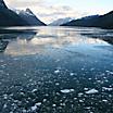 Abstract, brash ice forming at sundown in calm glacier bay, Strait of Magellan, Patagonia, Chile