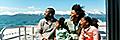 Family watching out for whales on an Alaskan Cruise