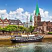 Historic town of Bremen with an old sailing ship on Weser river near Bremerhaven, Germany