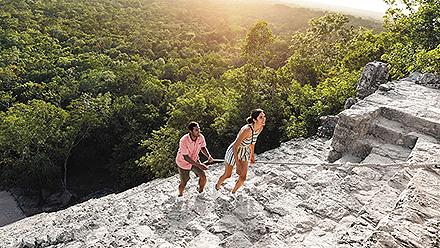 Couple Climbing up the Ruins Pyramid, Cozumel, Mexico 