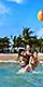 Dad holding two kids Mom CocoCay Beach HP Mobile 750 910 FAM NF 2x