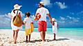 Family of four on a tropical summer beach getaway vacation. The Caribbean.