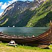 A Replica Viking Boat with Mountains in the Background, Flam, Norway 