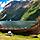 A Replica Viking Boat with Mountains in the Background, Flam, Norway 