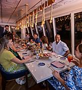 Friends Enjoying Dinner at Celebration Table