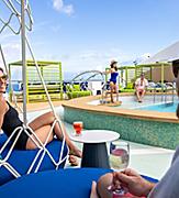 Couple Enjoying Wine by the Cove Pool