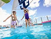 Kids Jumping In the Water's Edge Pool