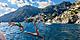 Italy Naples Positano Couple Jumping in Ocean