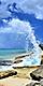 Wave Crashing Against Rocks on a Sunny Day in Frederiksted Beach, St. Croix, U.S. Virgin Islands